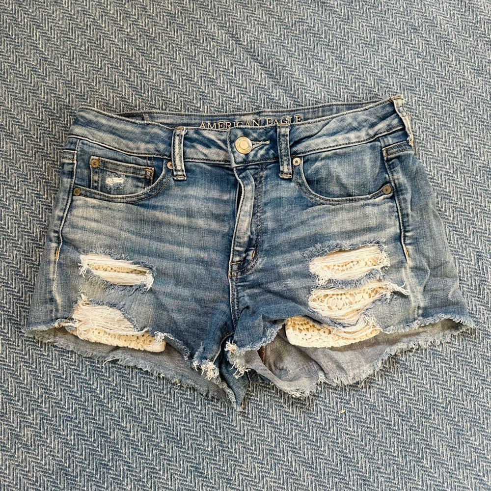 American Eagle Distressed Denim Shorts with Crochet pockets
